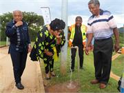 Minister Majodina drinking water from the tap at Maphumulo Water Treatment plant